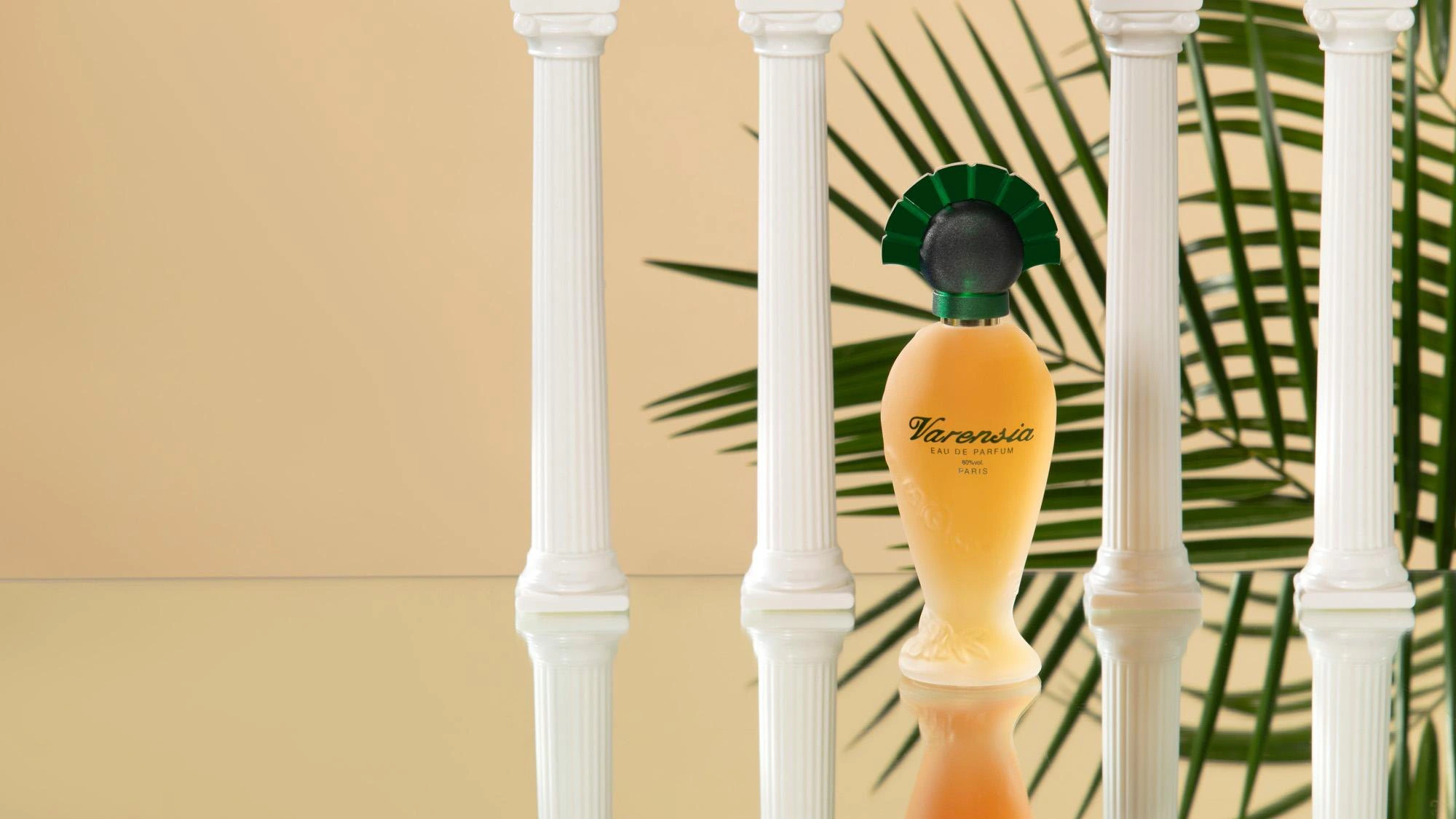 Varensia bottle between classical columns with palm leaves